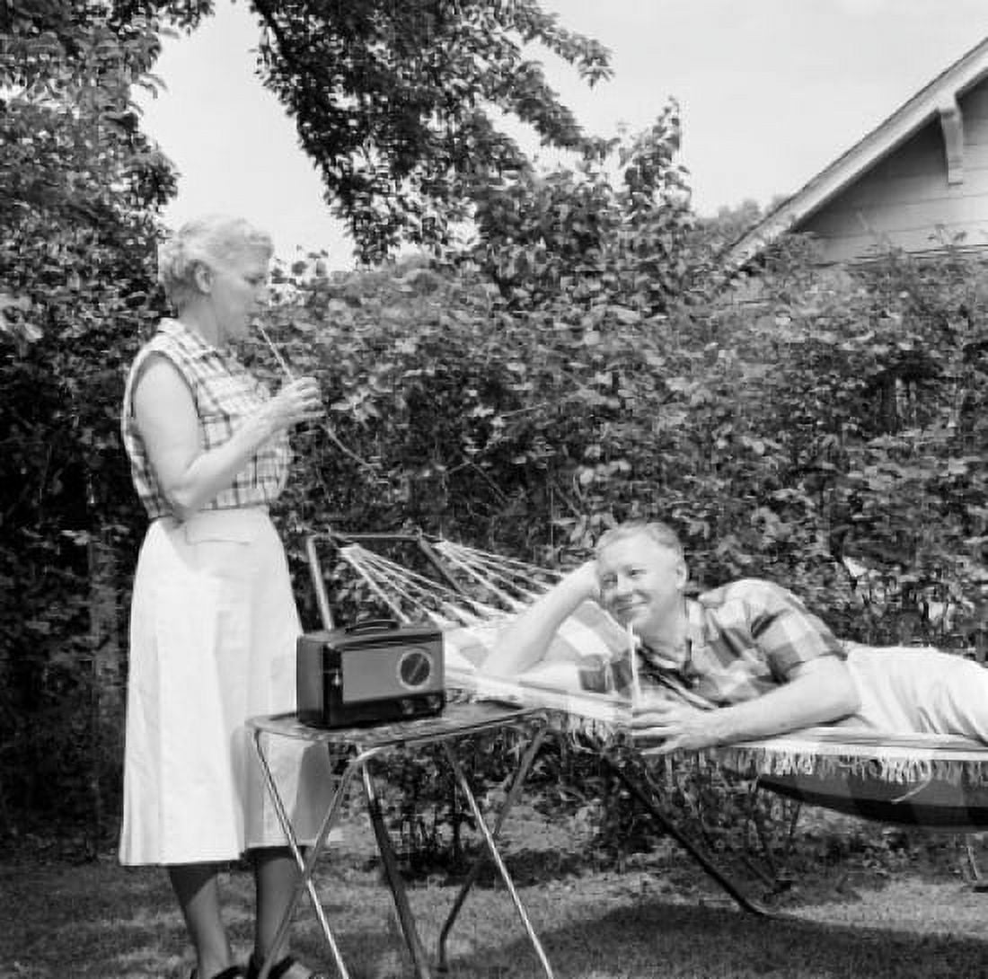 Senior couple relaxing in backyard Canvas Art - (24 x 36)