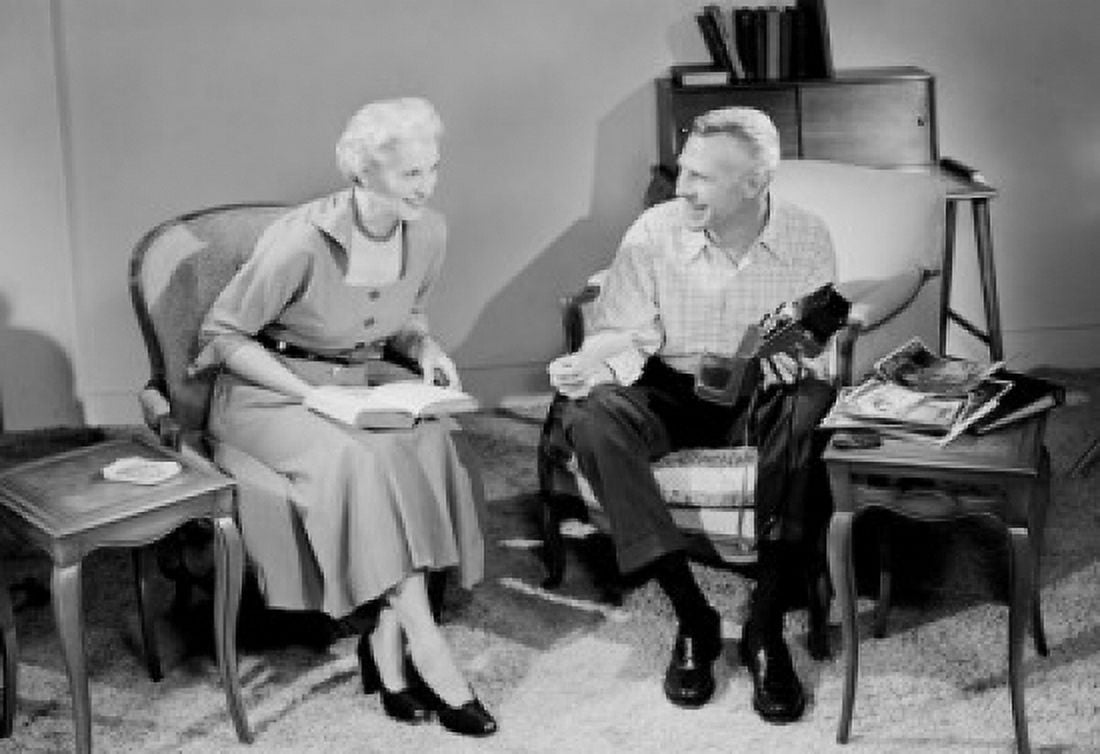 Senior couple relaxing in living room Canvas Art - (24 x 36)