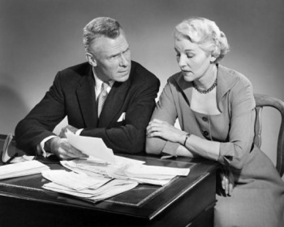 Senior couple sitting at a table and sorting out bills Canvas Art - (18 x 24)