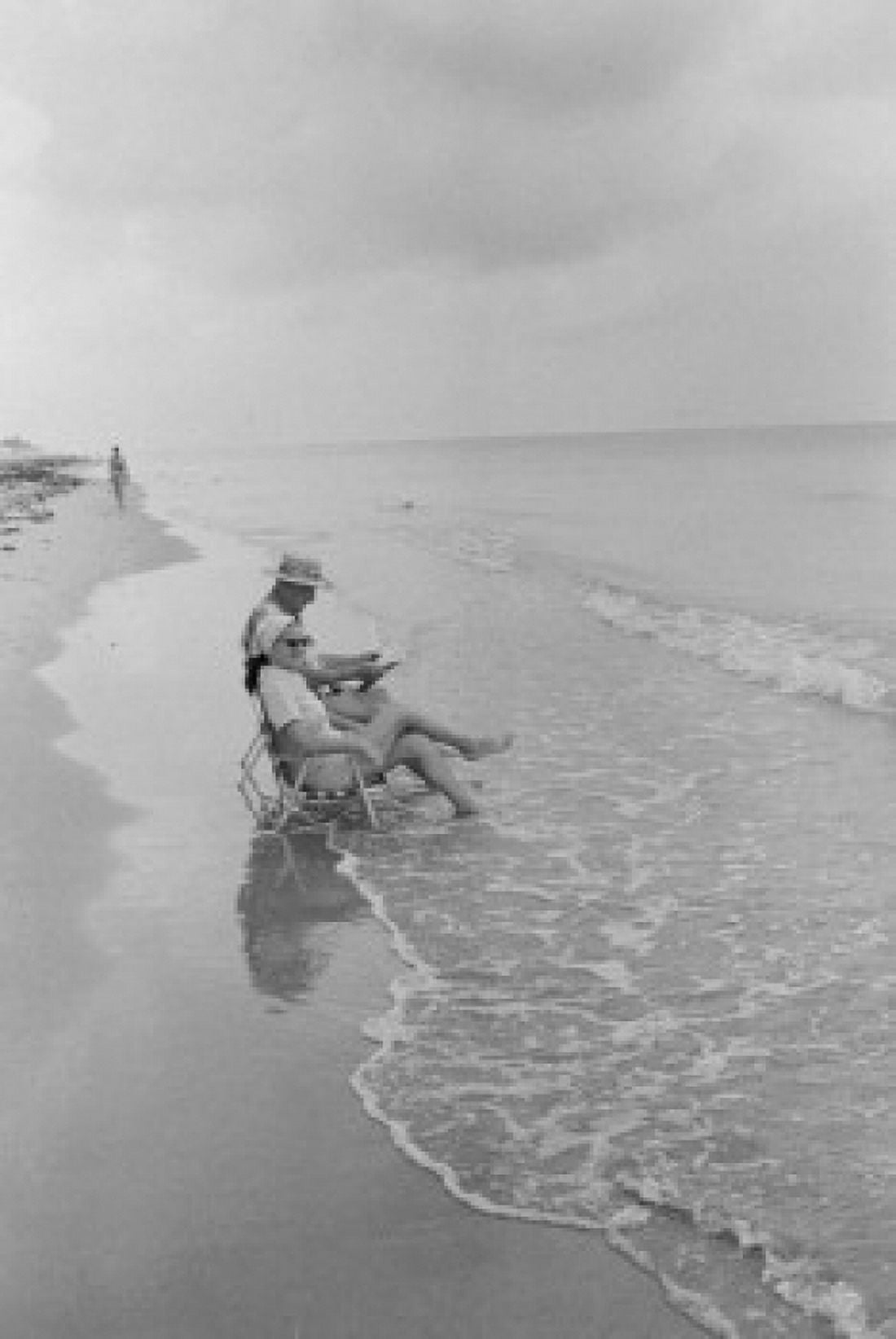 Senior couple sitting on the beach Canvas Art - (24 x 36)