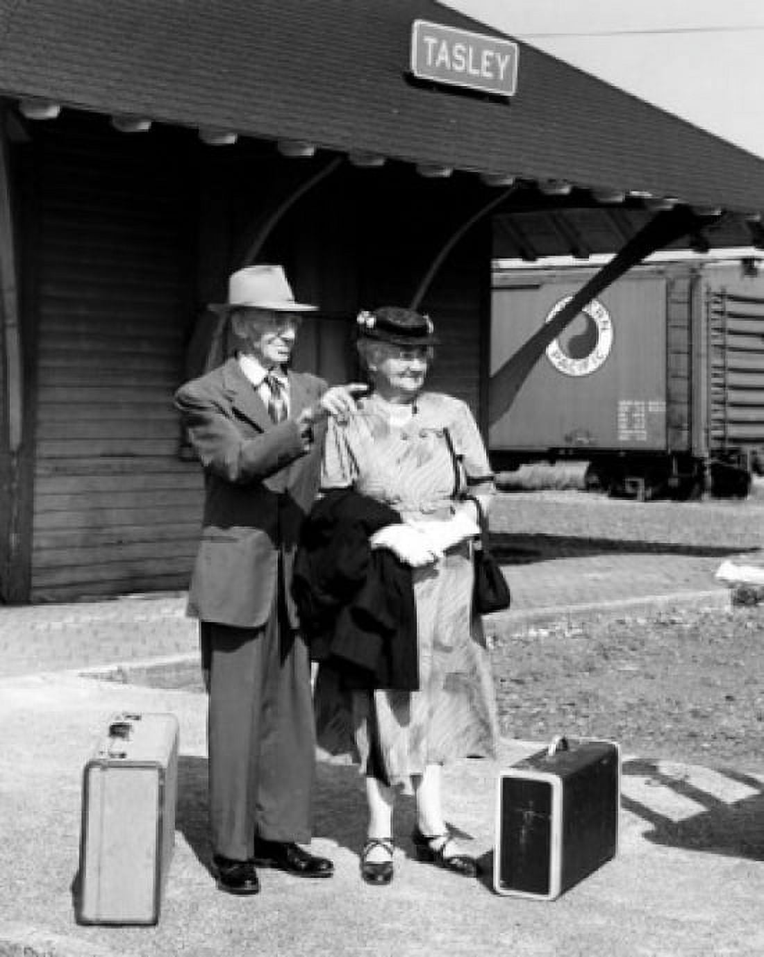 Senior couple waiting at railway station with luggage Canvas Art - (18 x 24)