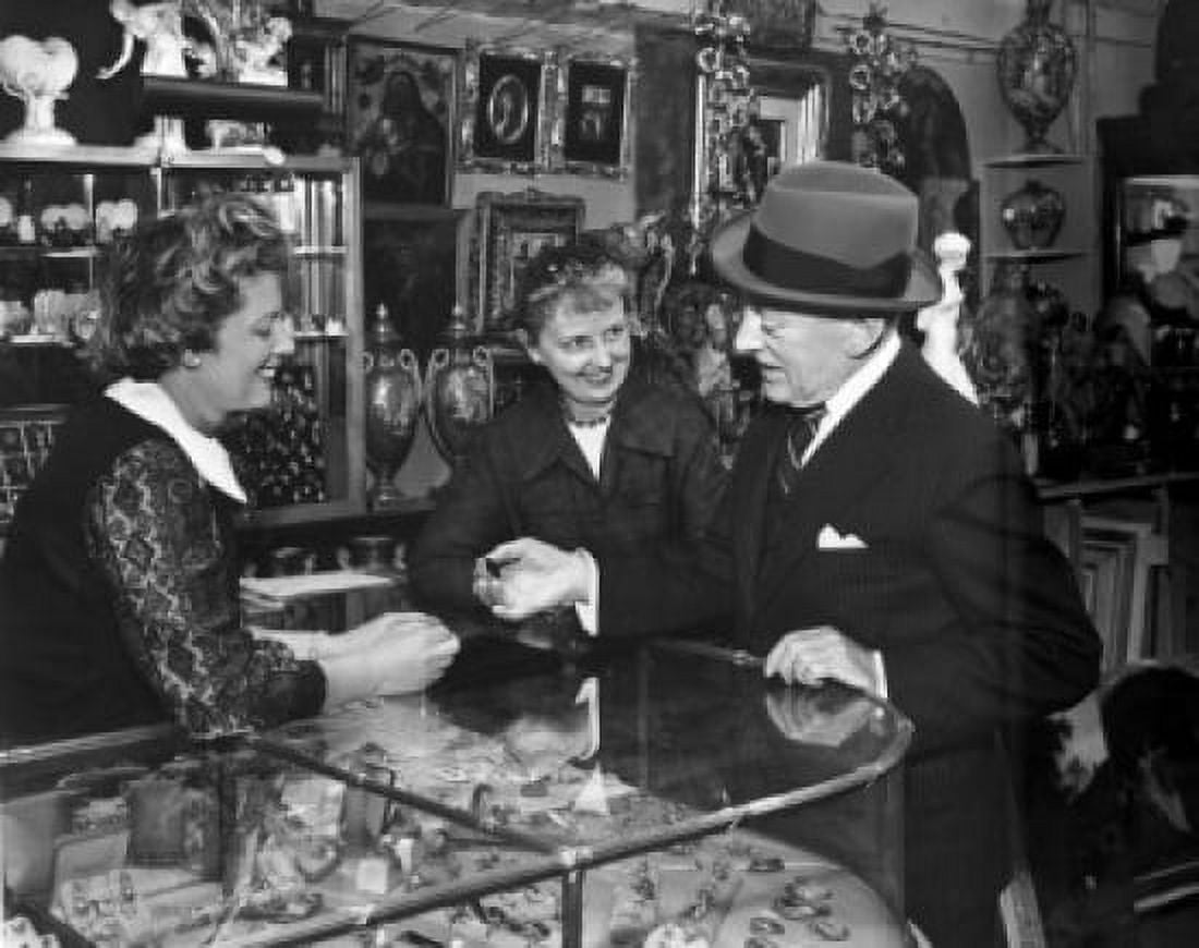 Senior man and two mature women standing in an antique shop Canvas Art - (18 x 24)