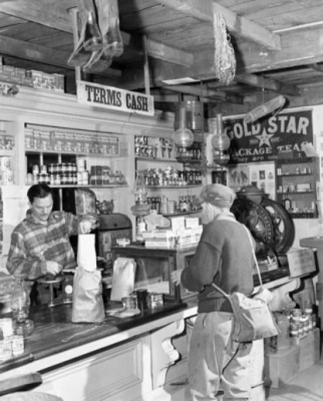Senior man at the checkout counter of a store Canvas Art - (24 x 36)