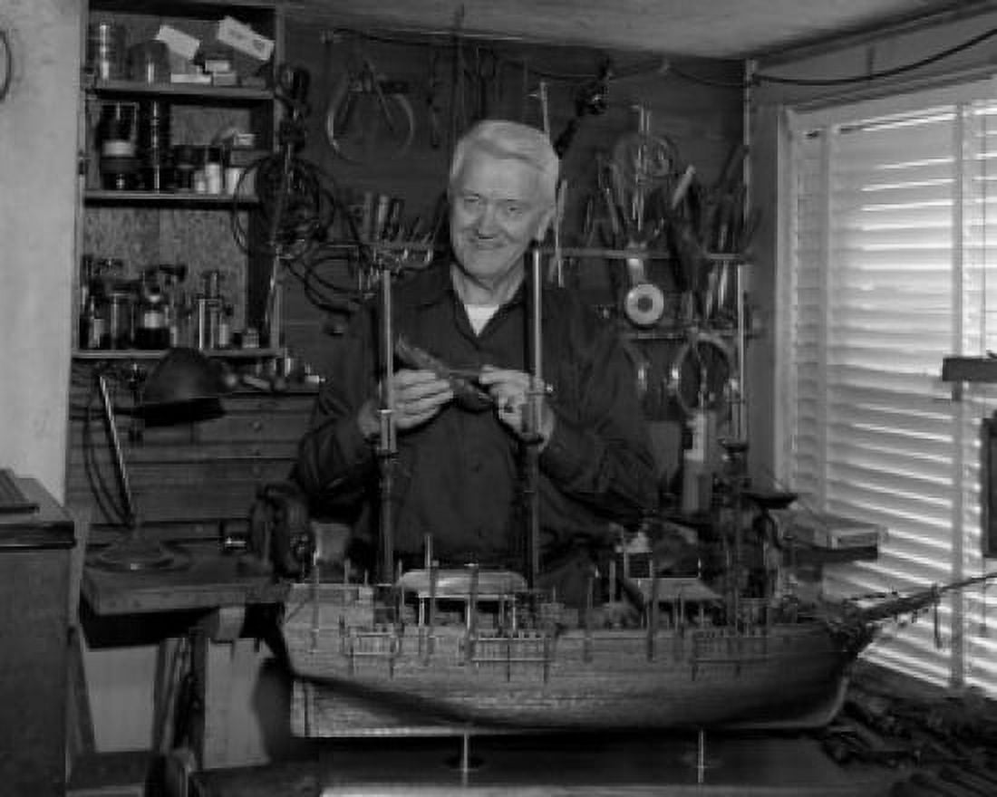 Senior man building model of ship Canvas Art -  (18 x 24)