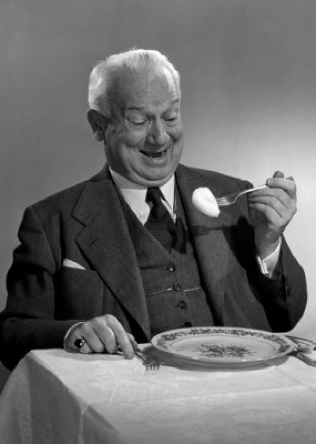 Senior man eating Canvas Art - (24 x 36)