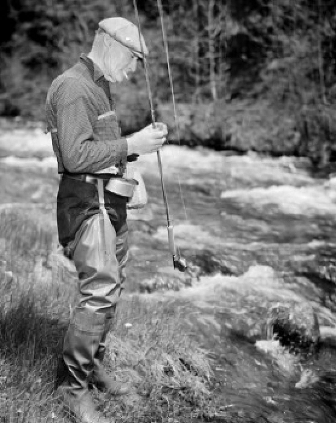 Senior man fishing in stream Canvas Art - (24 x 36)