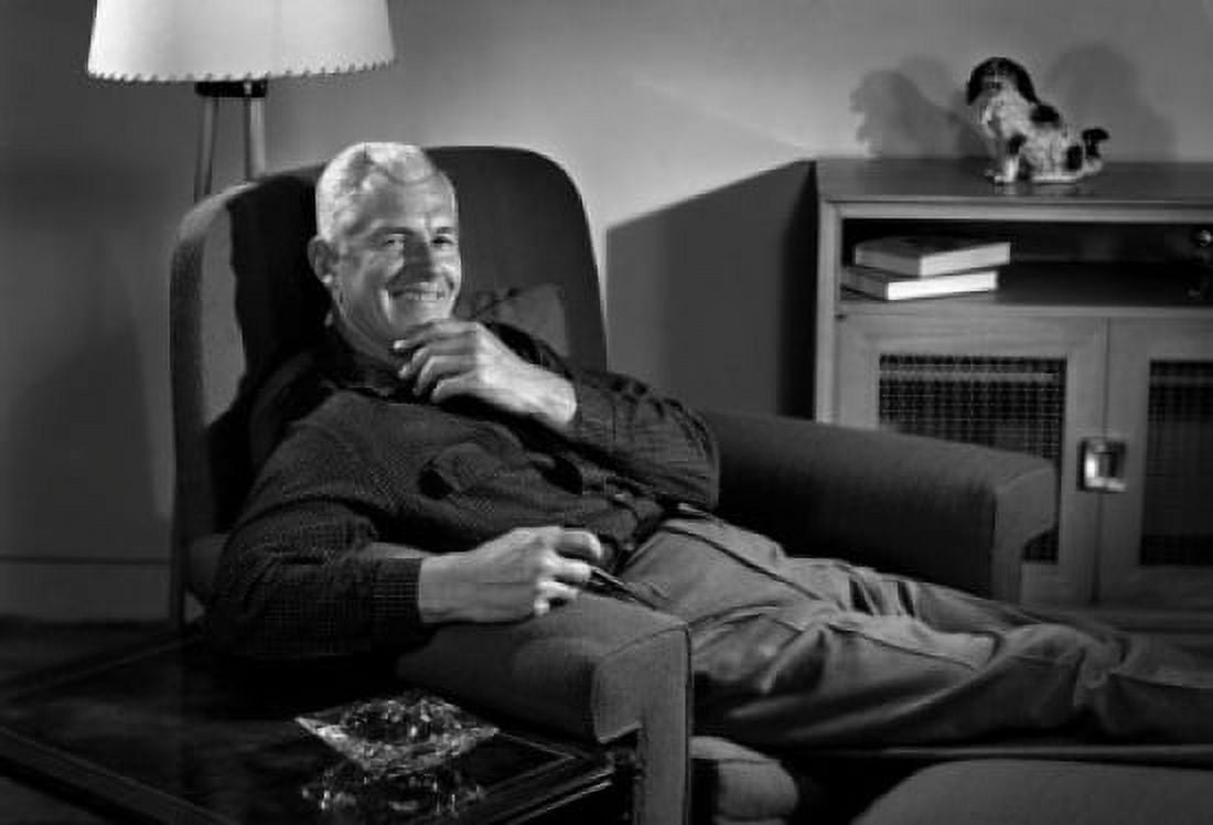 Senior man holding pipe and lying in armchair portrait Canvas Art - (24 x 36)