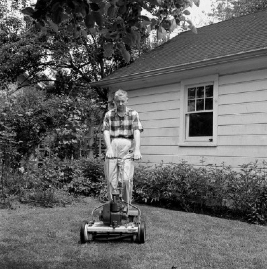 Senior man mowing grass in backyard Canvas Art -  (18 x 24)