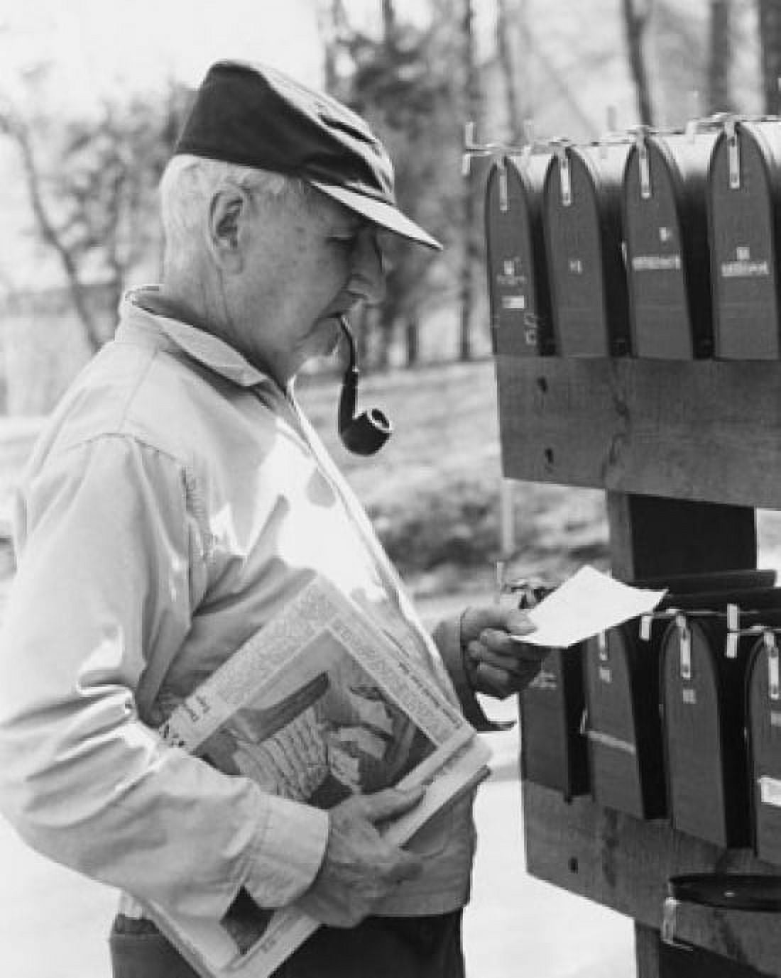 Senior man reading mail near mailboxes Canvas Art - (18 x 24)