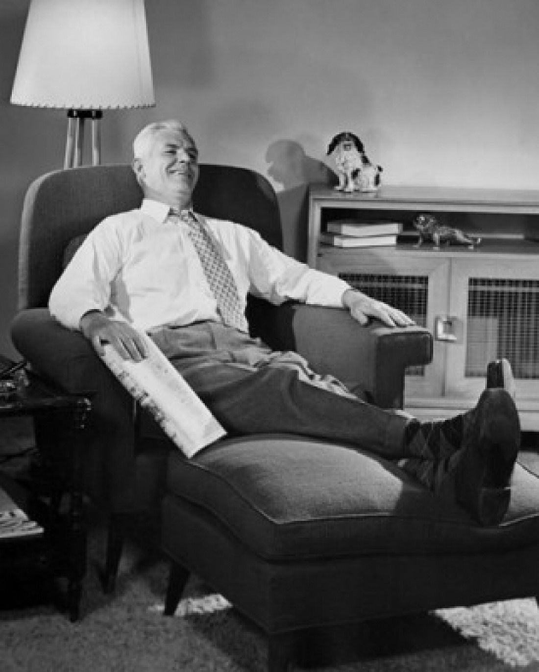 Senior man reclining in an armchair and smiling Canvas Art - (24 x 36)