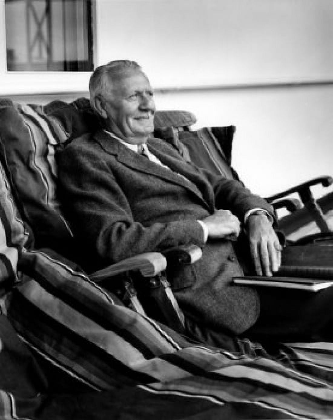 Senior man relaxing in porch swing Canvas Art - (24 x 36)