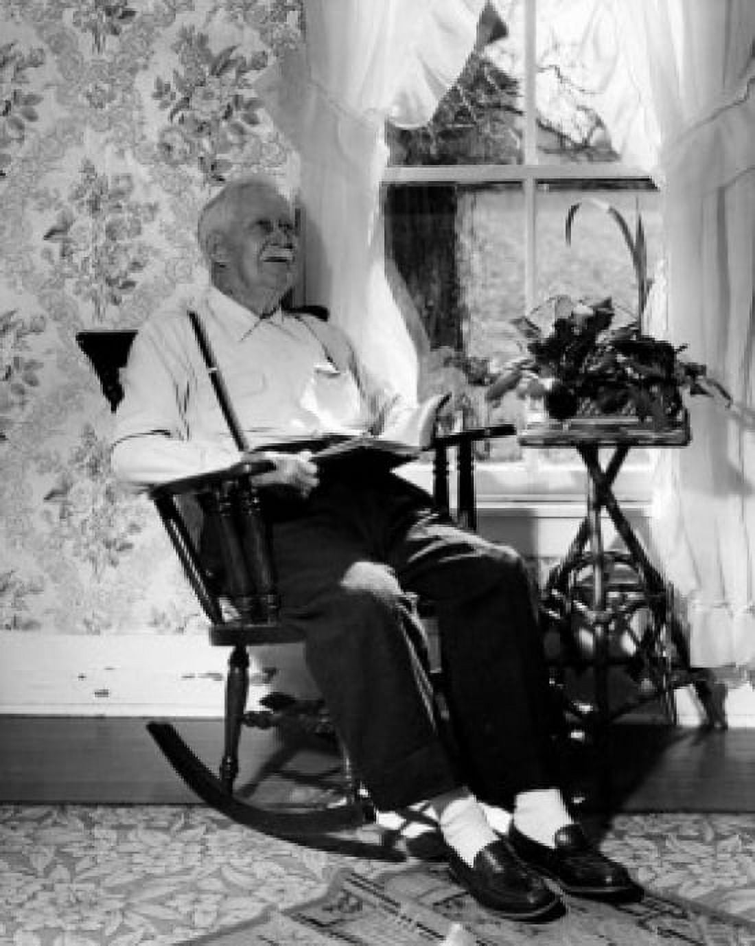 Senior man sitting in rocking chair Canvas Art - (24 x 36)