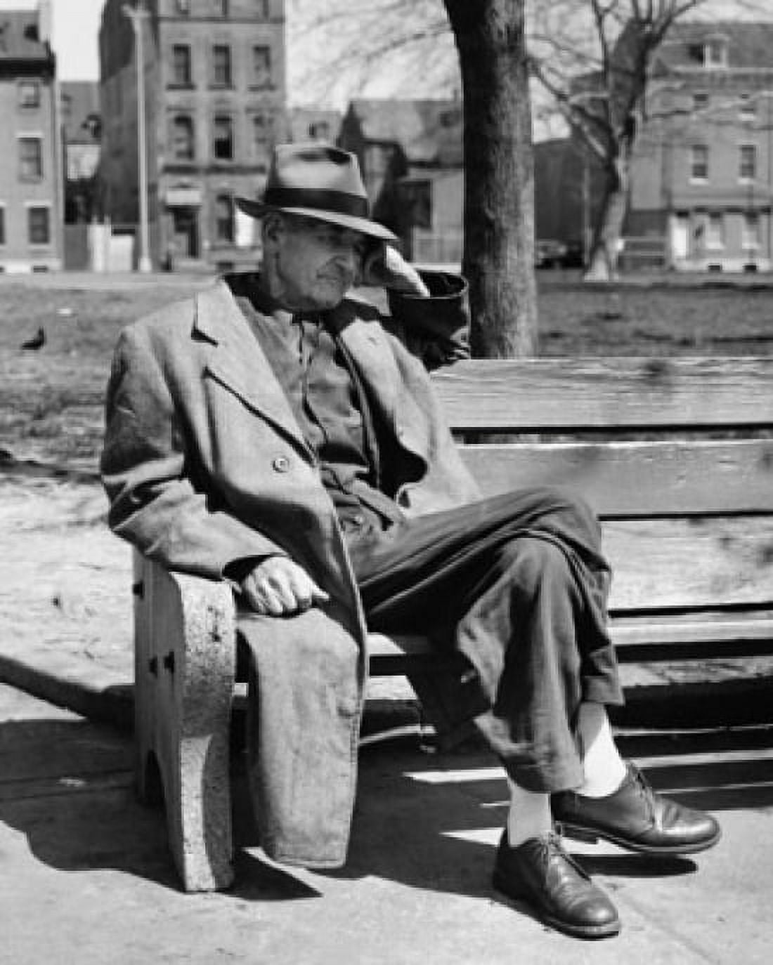 Senior man sitting on a park bench and thinking Canvas Art - (24 x 36)