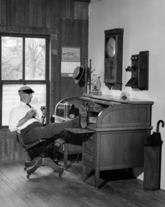 Senior man sitting with feet on desk Canvas Art - (18 x 24)