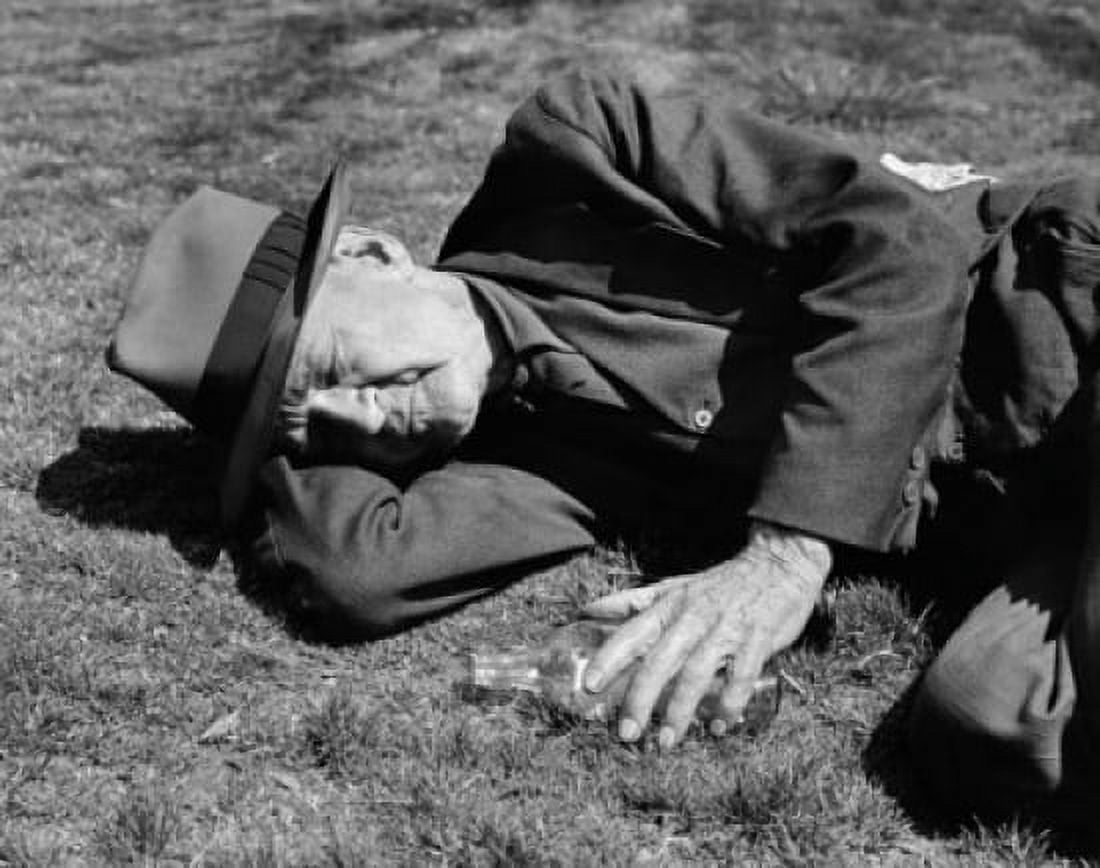 Senior man sleeping on the ground Canvas Art - (18 x 24)