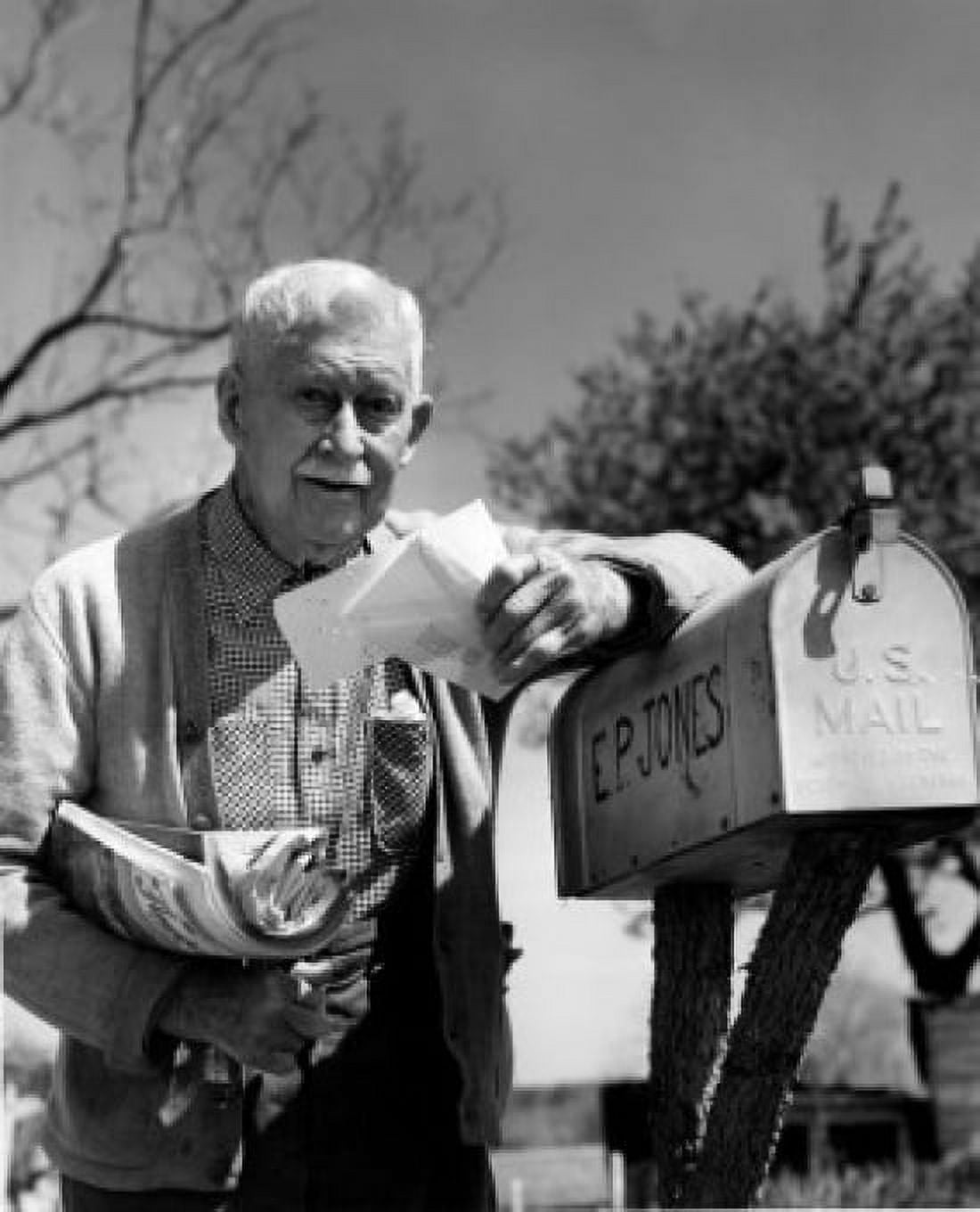 Senior man taking out correspondence from mailbox Canvas Art - (18 x 24)