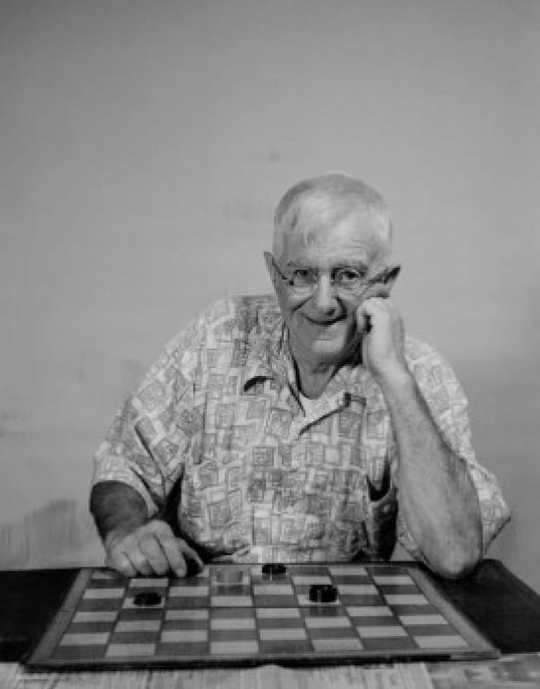Senior man with checkers looking at camera and smiling Canvas Art - (18 x 24)