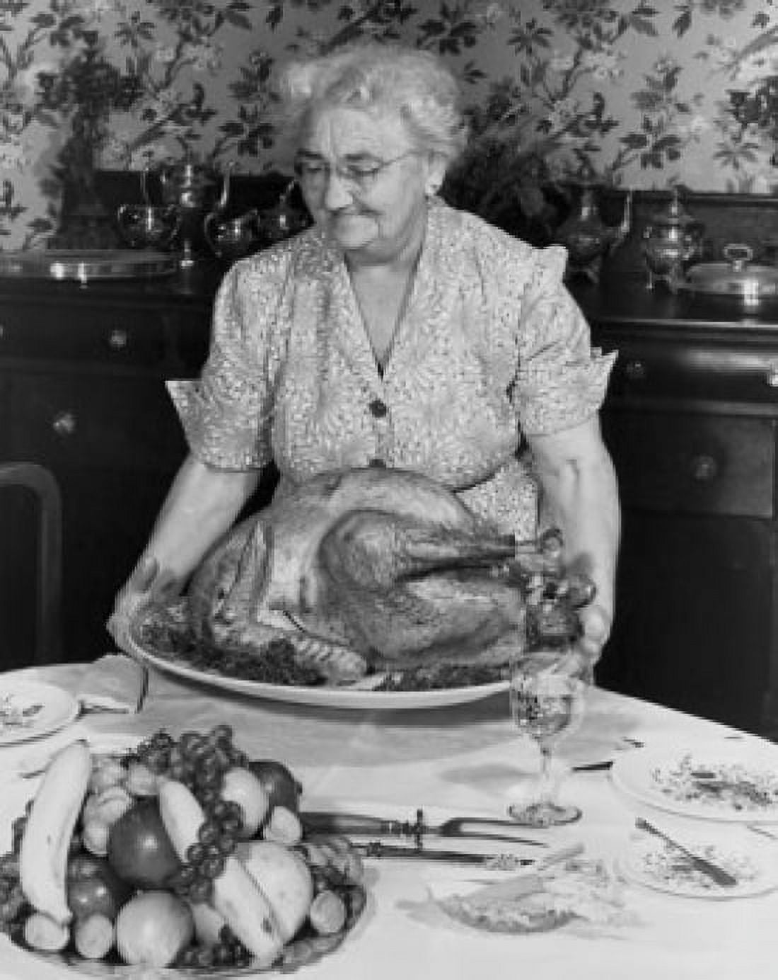 Senior woman holding a roasted turkey Canvas Art - (24 x 36)