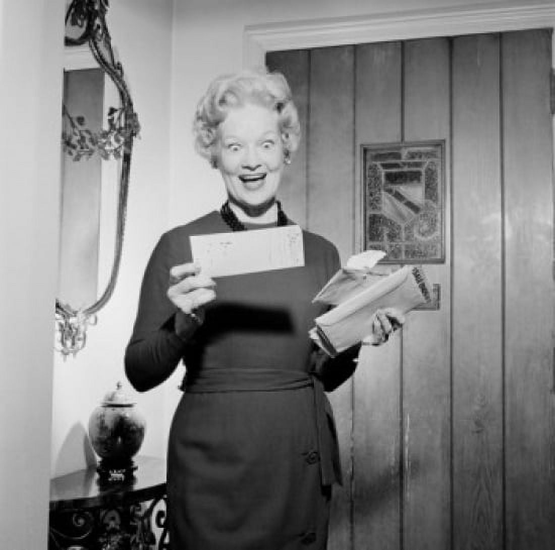 Senior woman opening and reading letter Canvas Art - (24 x 36)