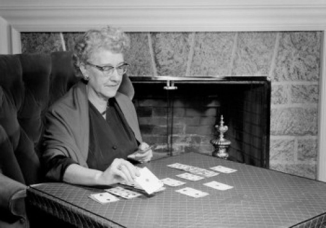 Senior woman playing cards in living room Canvas Art - (18 x 24)