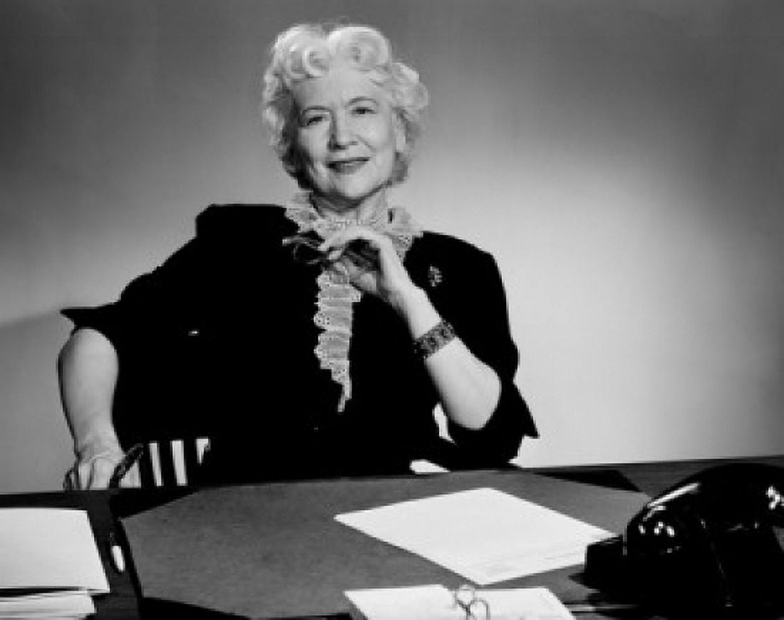 Senior woman sitting at desk Canvas Art - (24 x 36)