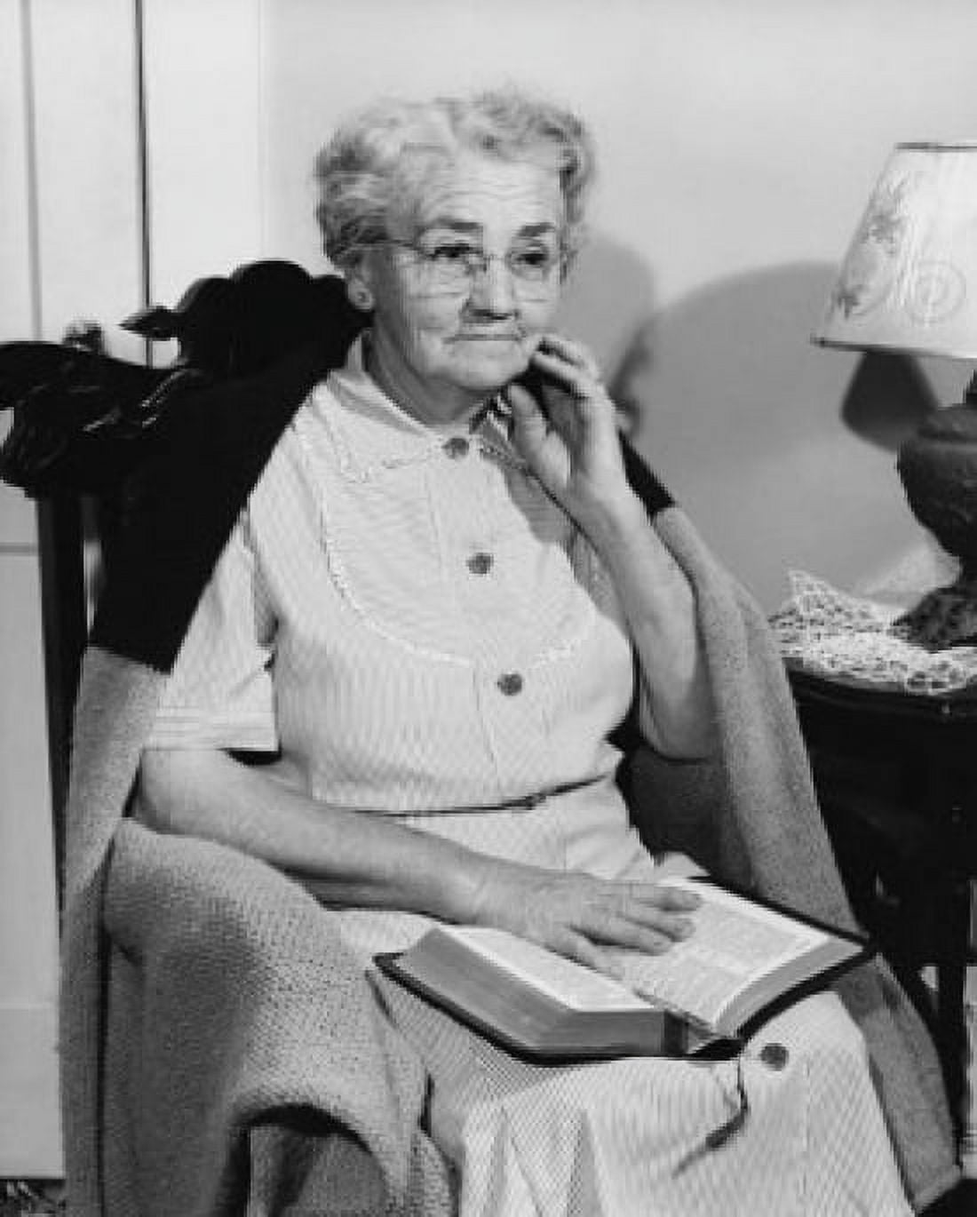 Senior woman sitting in a rocking chair with the Bible on her lap Canvas Art -  (18 x 24)