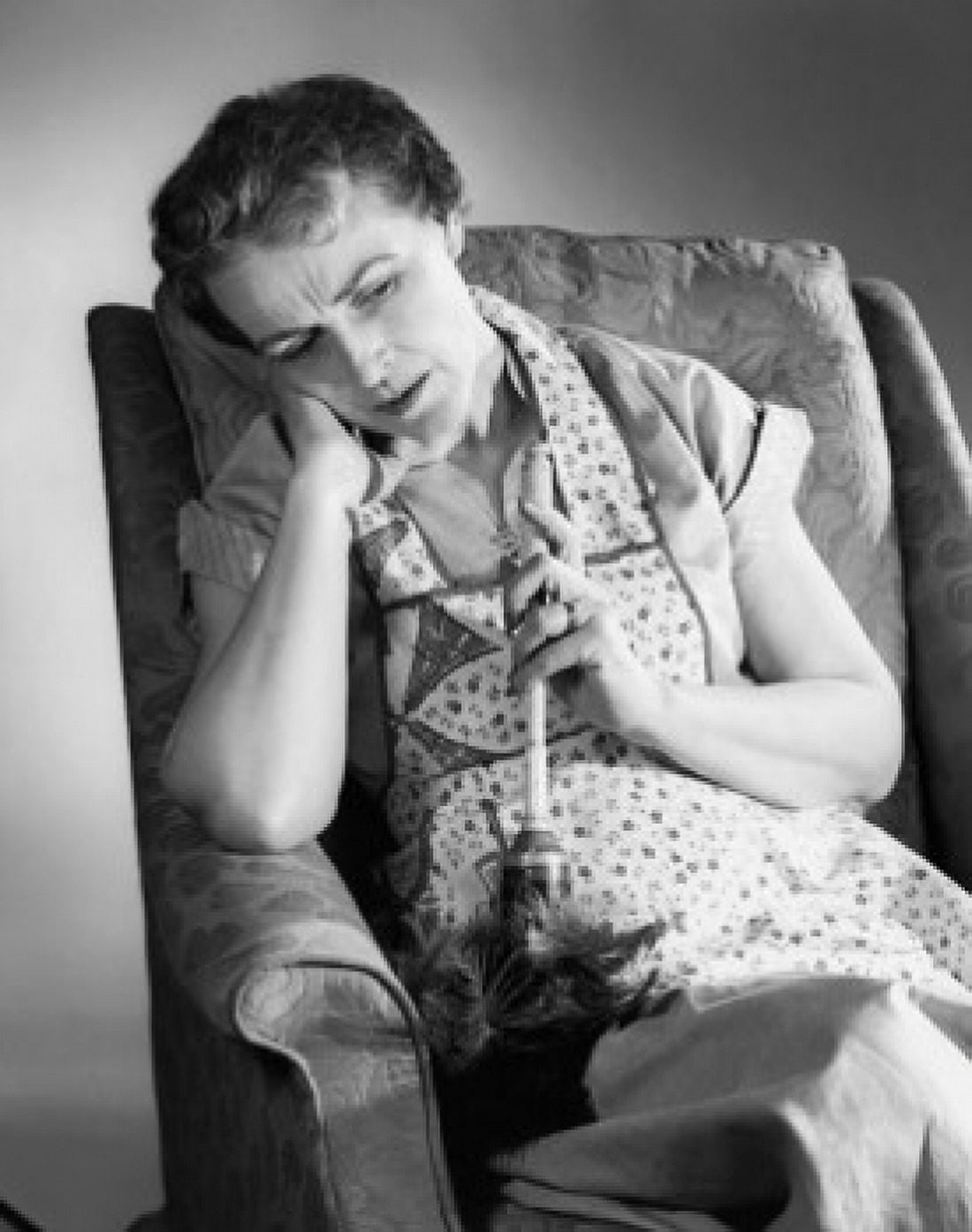 Senior woman sitting on an armchair Canvas Art - (24 x 36)