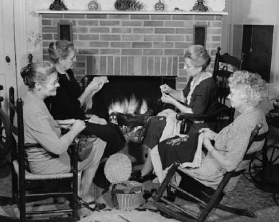 Senior women sitting in chairs near a fireplace and knitting Canvas Art - (24 x 36)