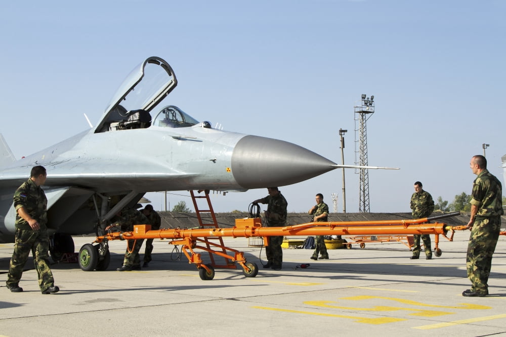 Serbian Air Force technicians preparing an MiG-29 for flight Canvas Art - Anton BalakchievStocktrek Images (18 x 12)