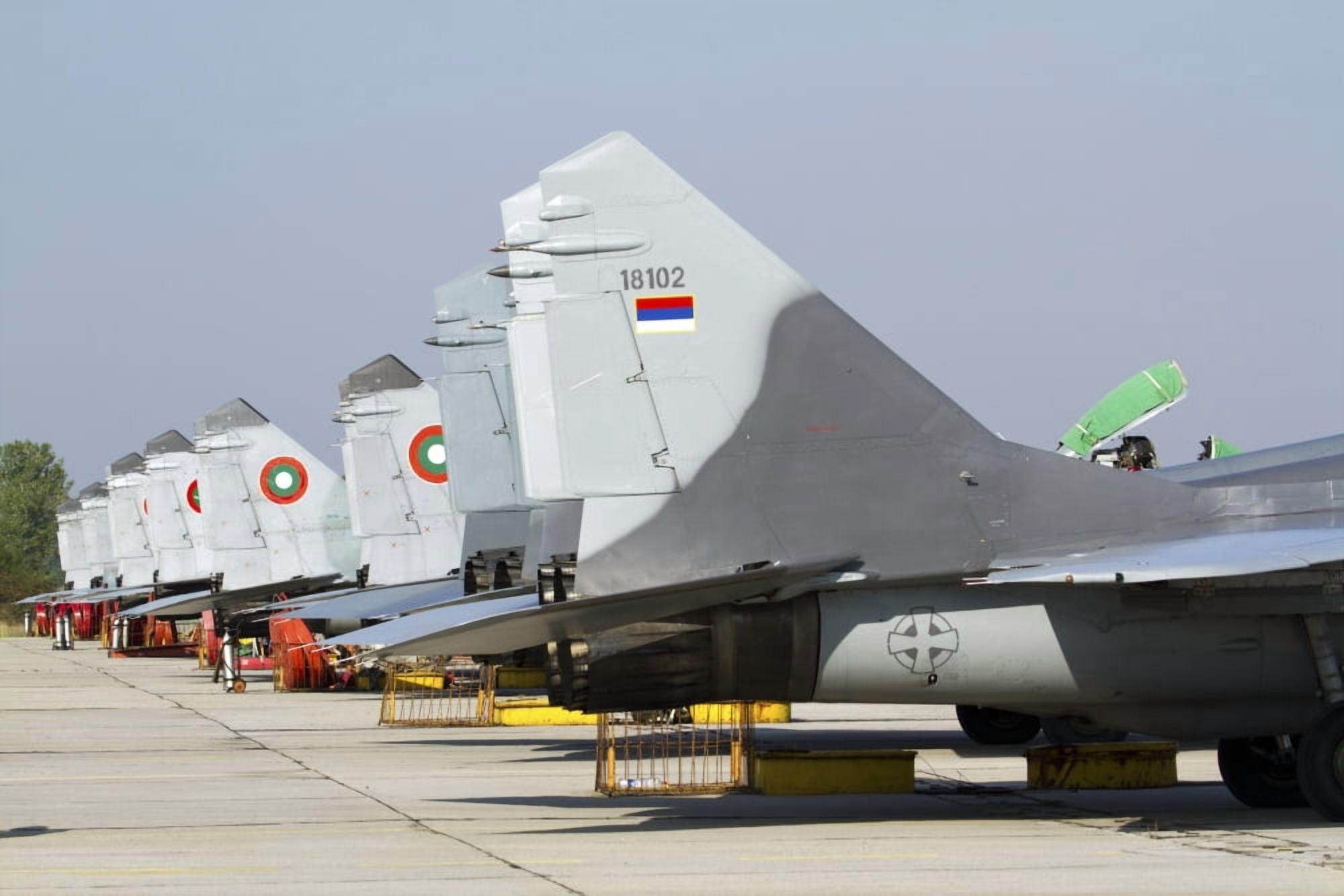 Serbian and Bulgarian MiG-29s parked at Graf Ignatievo Air Base Canvas Art - Anton BalakchievStocktrek Images (17 x 12)