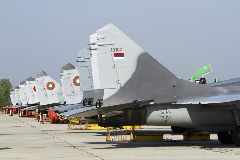 Serbian and Bulgarian MiG-29s parked at Graf Ignatievo Air Base Canvas Art - Anton BalakchievStocktrek Images (34 x 23)