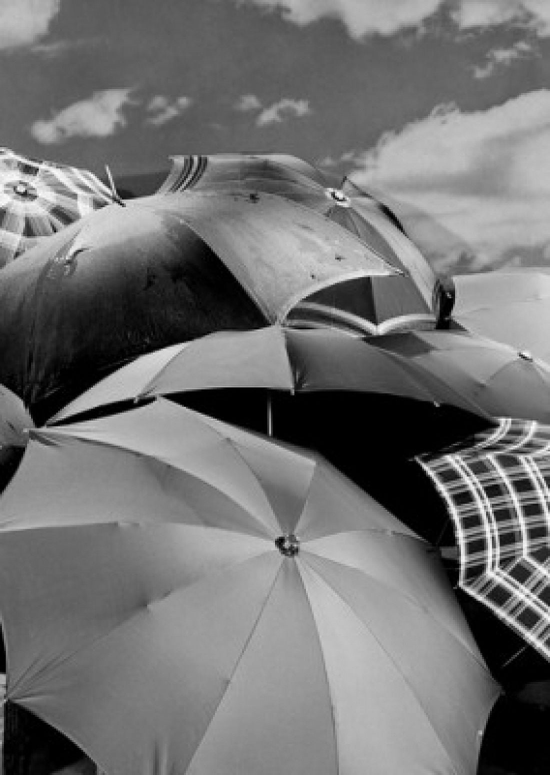 Several umbrellas stacked together with sky in background Canvas Art - (18 x 24)