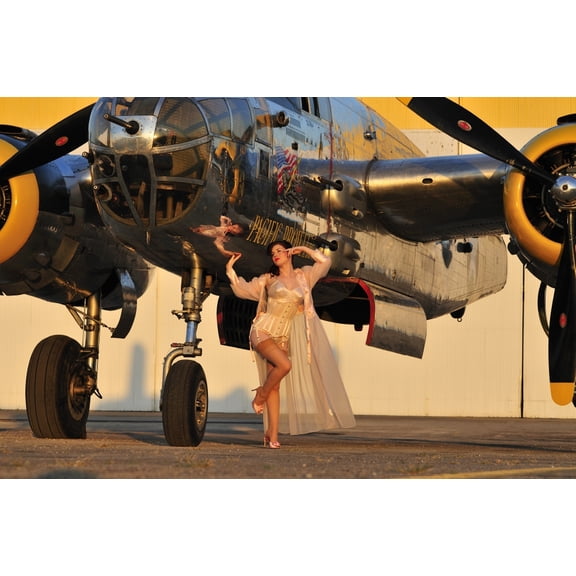 Sexy 1940s pin-up girl in lingerie posing with a B-25 bomber Canvas Art - Christian KiefferStocktrek Images (18 x 12)