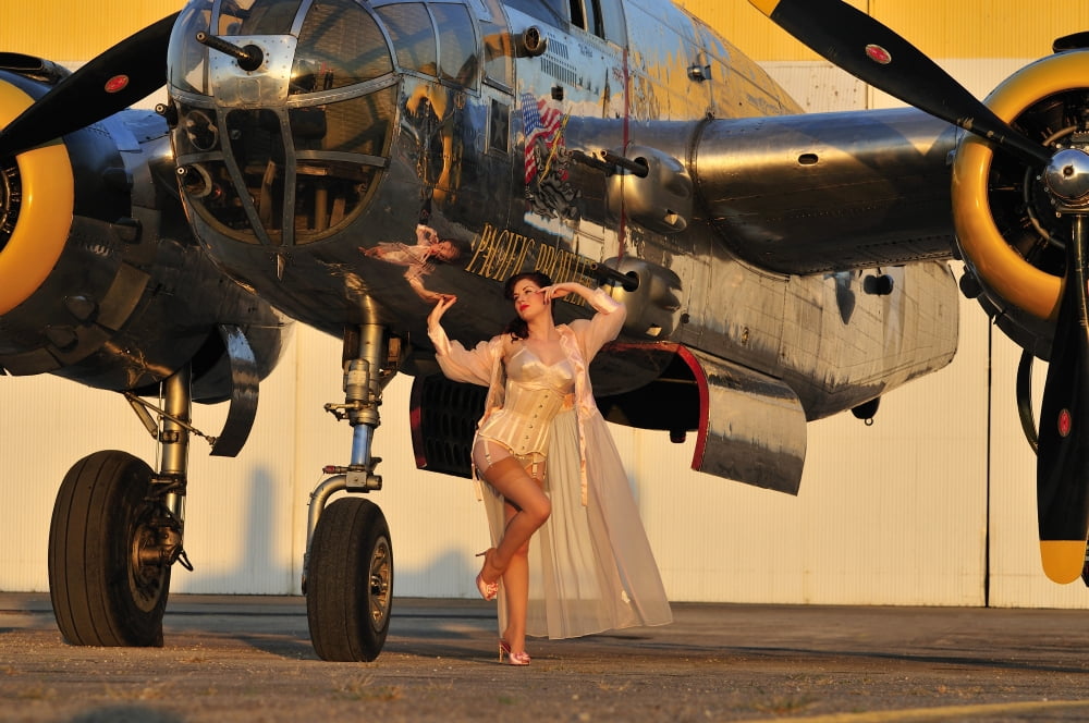 Sexy 1940s pin-up girl in lingerie posing with a B-25 bomber Canvas Art - Christian KiefferStocktrek Images (35 x 23)