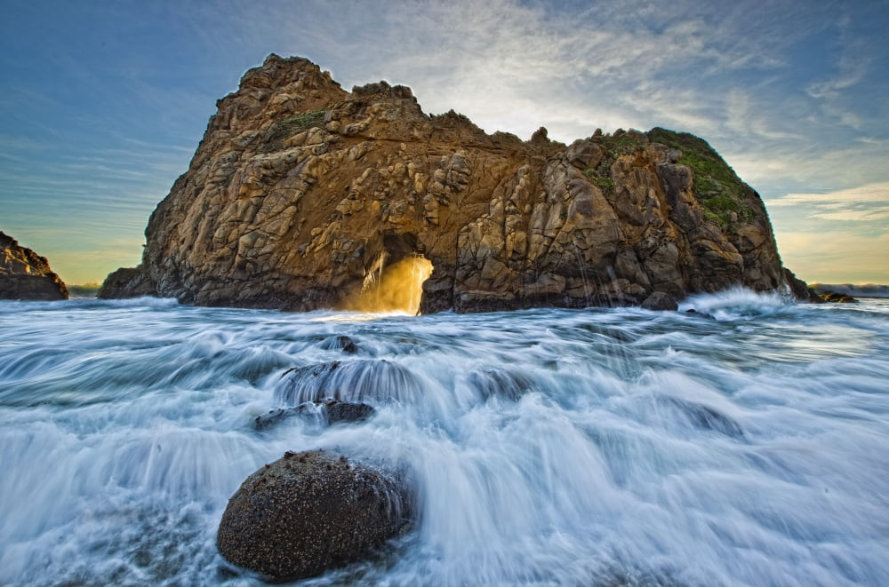 Shaft Of Sunlight Through Hole In Rock Pfeiffer Beach California Canvas Art - Robert Postma Design Pics (17 x 11)