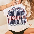 thumbnail image 1 of She Loves Jesus and America Too T-Shirt, 4th of July Christian Shirt, Coquette USA Girl Shirt, Memorial Day Jesus Shirt, 1 of 5