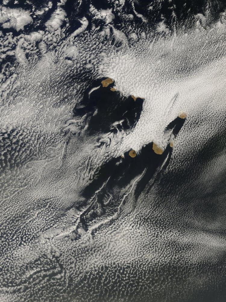 Ship-wave-shaped wave clouds and cloud vortices induced by the Cape Verde Islands Canvas Art - Stocktrek Images (24 x 32)