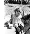 thumbnail image 1 of Shirley Temple sitting on the River Bank in aClassic Portrait Photo Print (8 x 10), 1 of 1