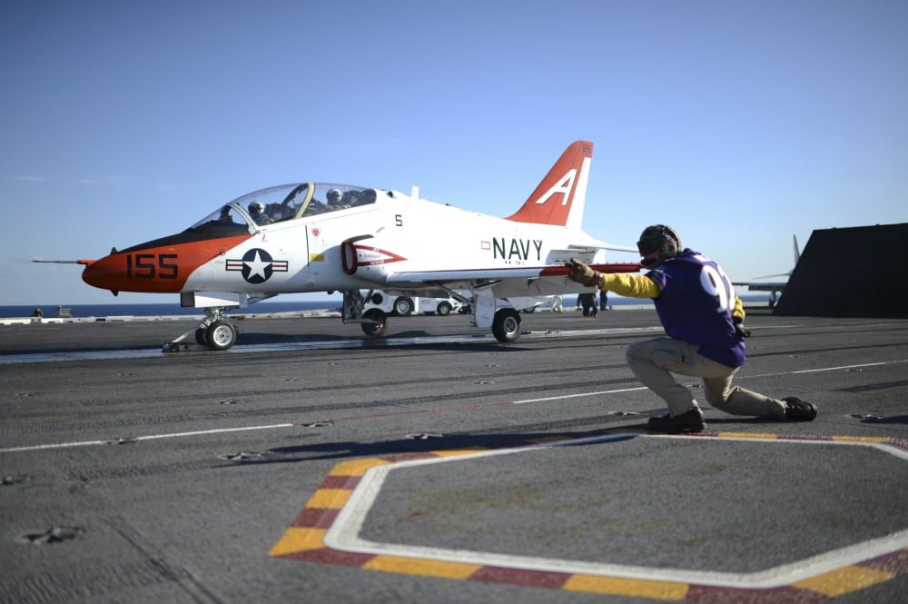 Shooter signals to the pilot of a T-45C Goshawk training aircraft Canvas Art - Stocktrek Images (35 x 23)