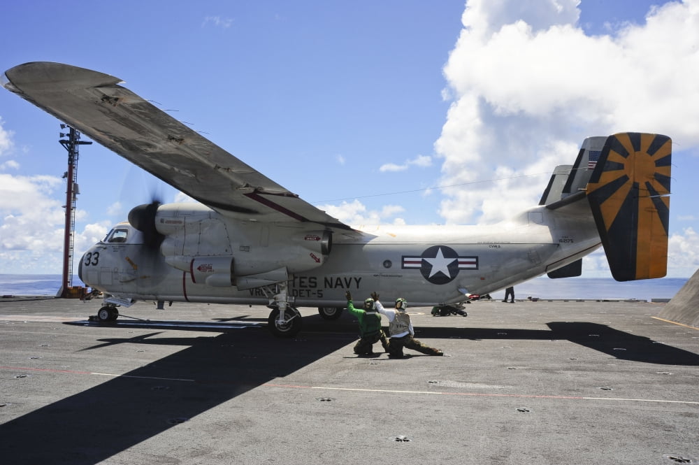 Shooters give the signal to launch a C-2A Greyhound aboard USS George Washington Canvas Art - Stocktrek Images (34 x 23)