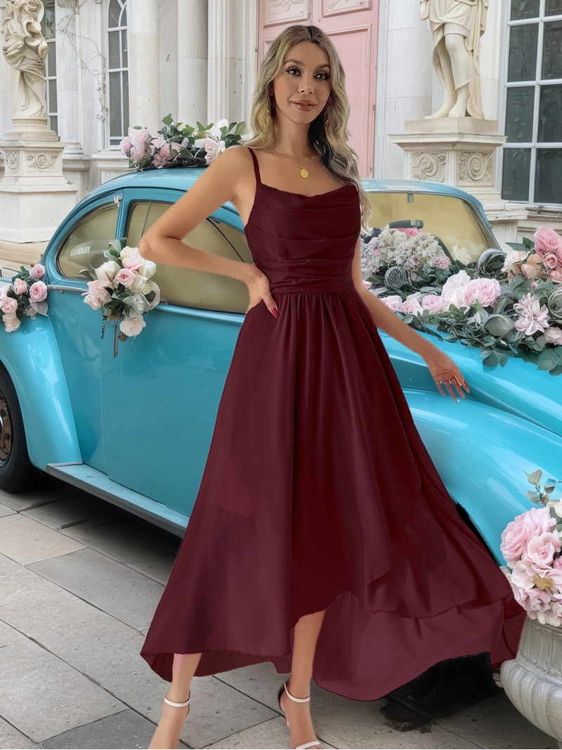 Short in the front and long in the back, with adjustable shoulder straps, a sophisticated party dress