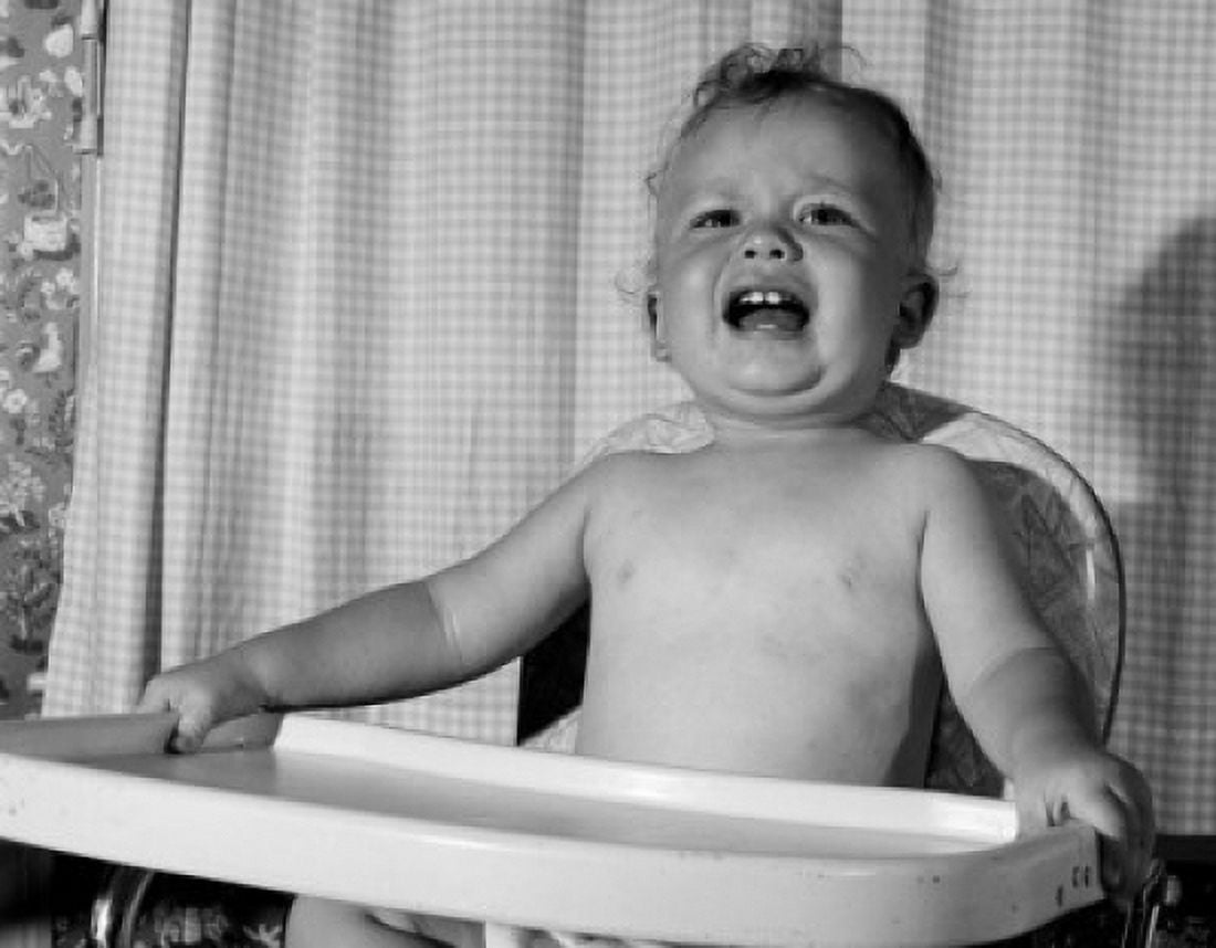 Shouting baby sitting in high chair Canvas Art - (24 x 36)