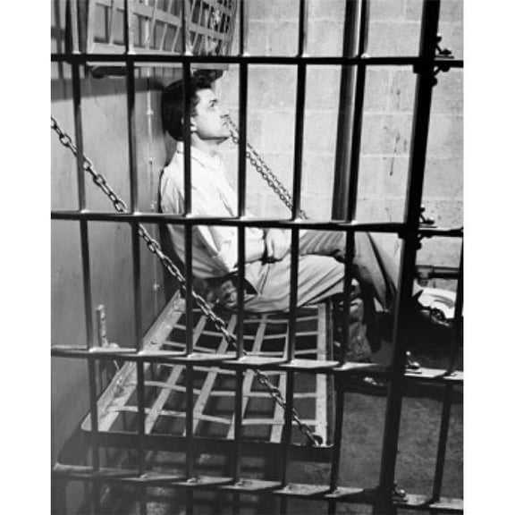 Side Profile of a Male Prisoner Sitting in a Prison Cell Poster Print 18 x 24 in.