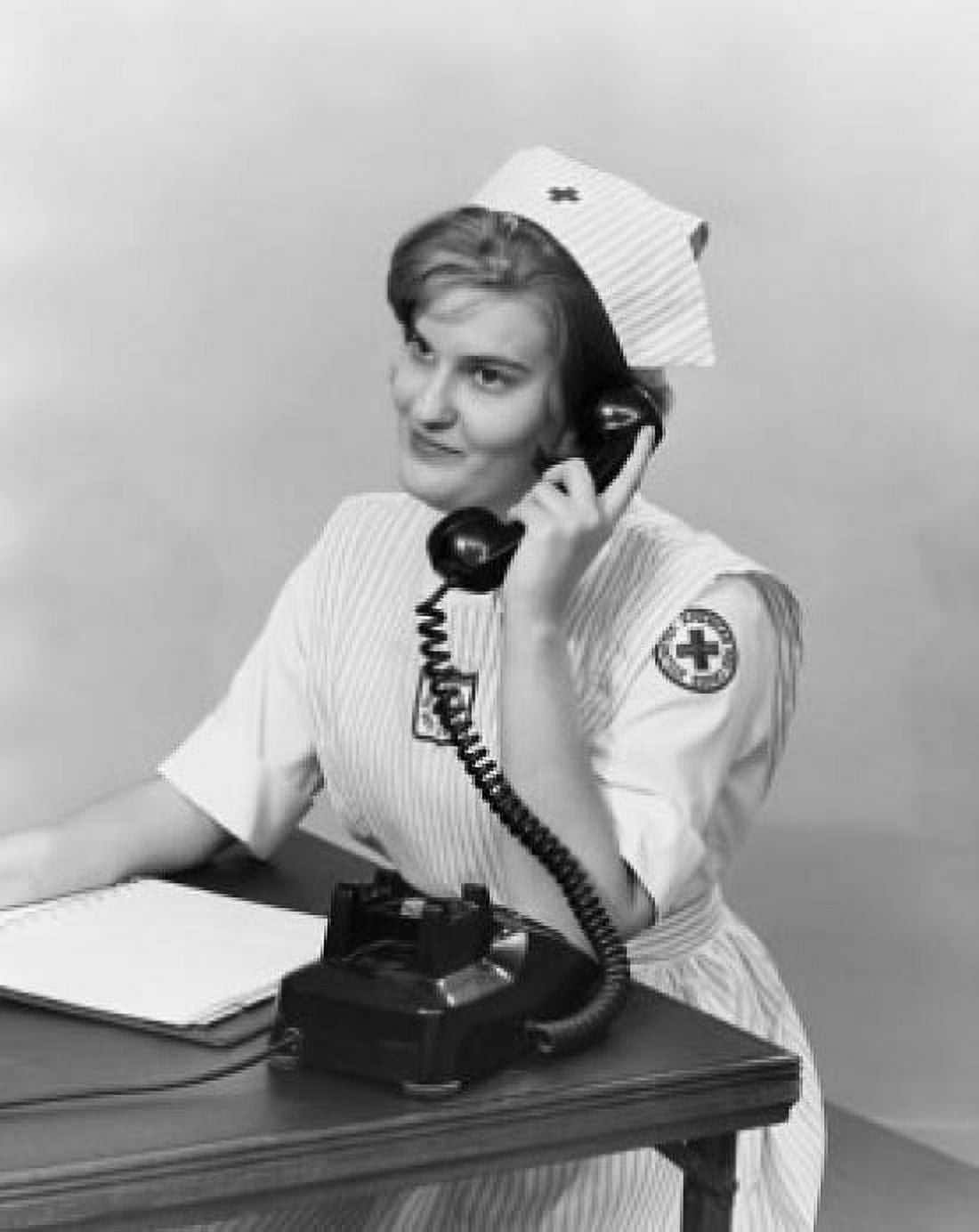 Side profile a female nurse talking on the telephone and scheduling appointments Canvas Art - (18 x 24)