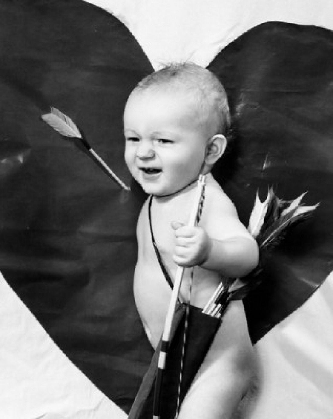 Side profile of a baby boy holding a bow and arrow Canvas Art - (18 x 24)