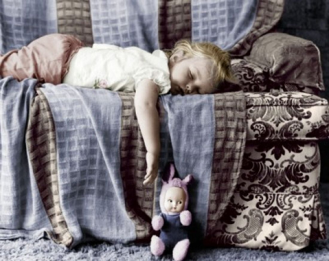 Side profile of a baby girl sleeping on a couch Canvas Art - (18 x 24)