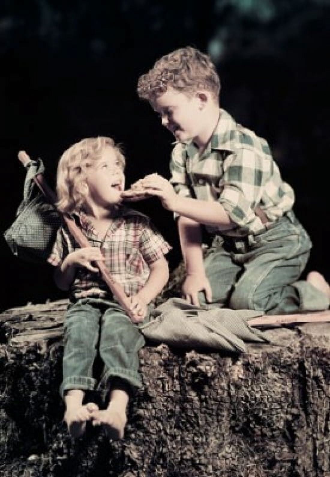 Side profile of a boy feeding a girl sitting on a rock Canvas Art - (18 x 24)