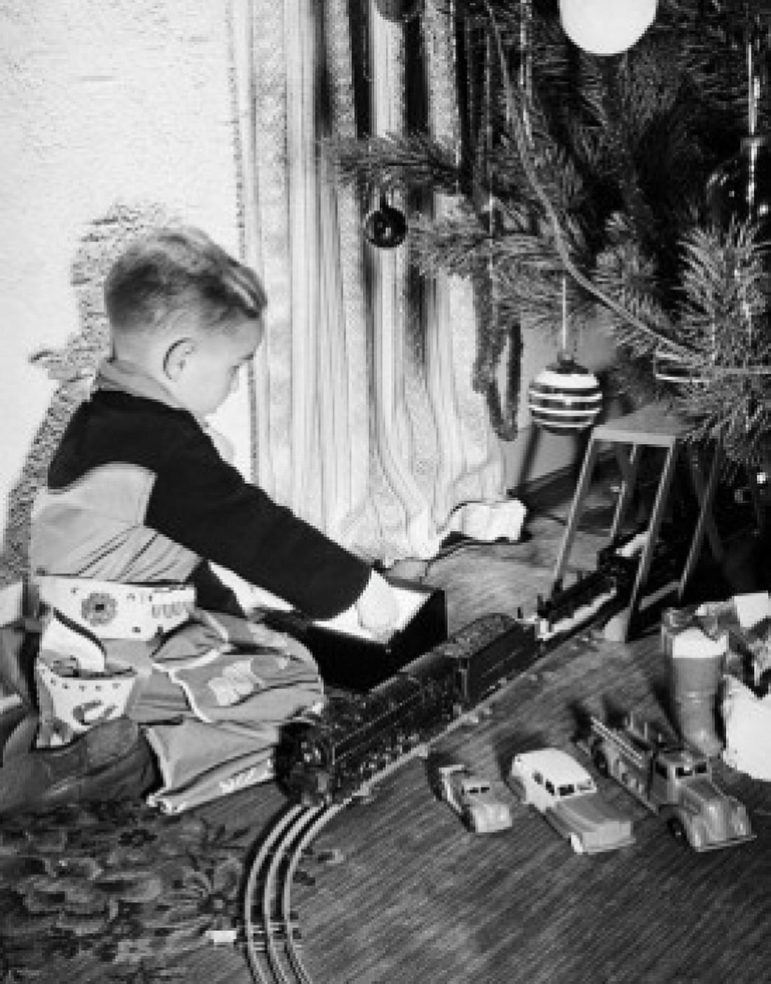 Side profile of a boy playing with a toy train Canvas Art - (24 x 36)