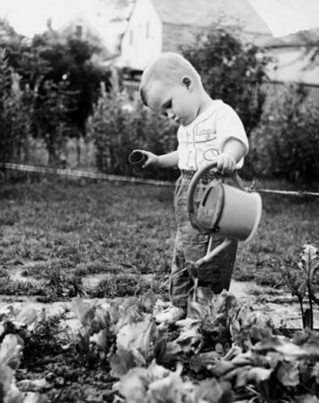 Side profile of a boy watering plants Canvas Art - (18 x 24)