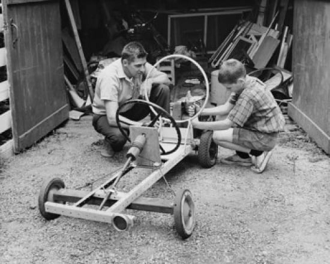Side profile of a boy with his father making a model of a car Canvas Art - (24 x 36)